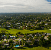 Image of buildings surrounded by lush greenery