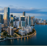 Images of skyscrapers towering by the waterfront